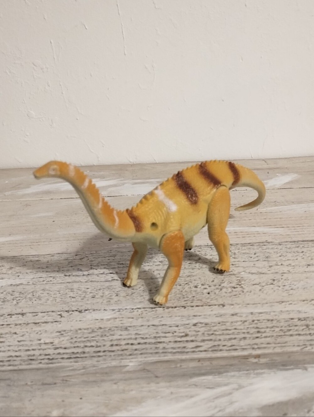 Spiked Sauropod Dinosaur 8” Figure Articulated Long Neck Toy Tan Orange Striped